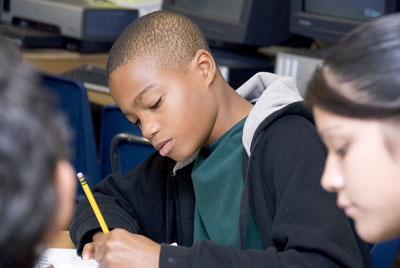 Young student working in classroom Young student working in classroom