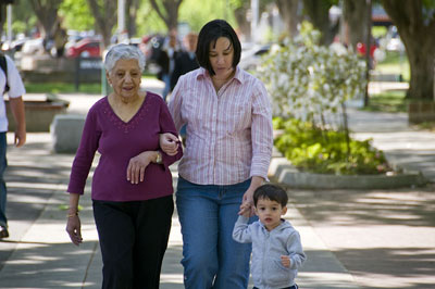 Mother ,daughter, and child walking together