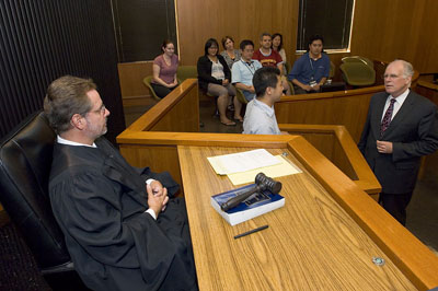 Students participating in mock courtroom trial